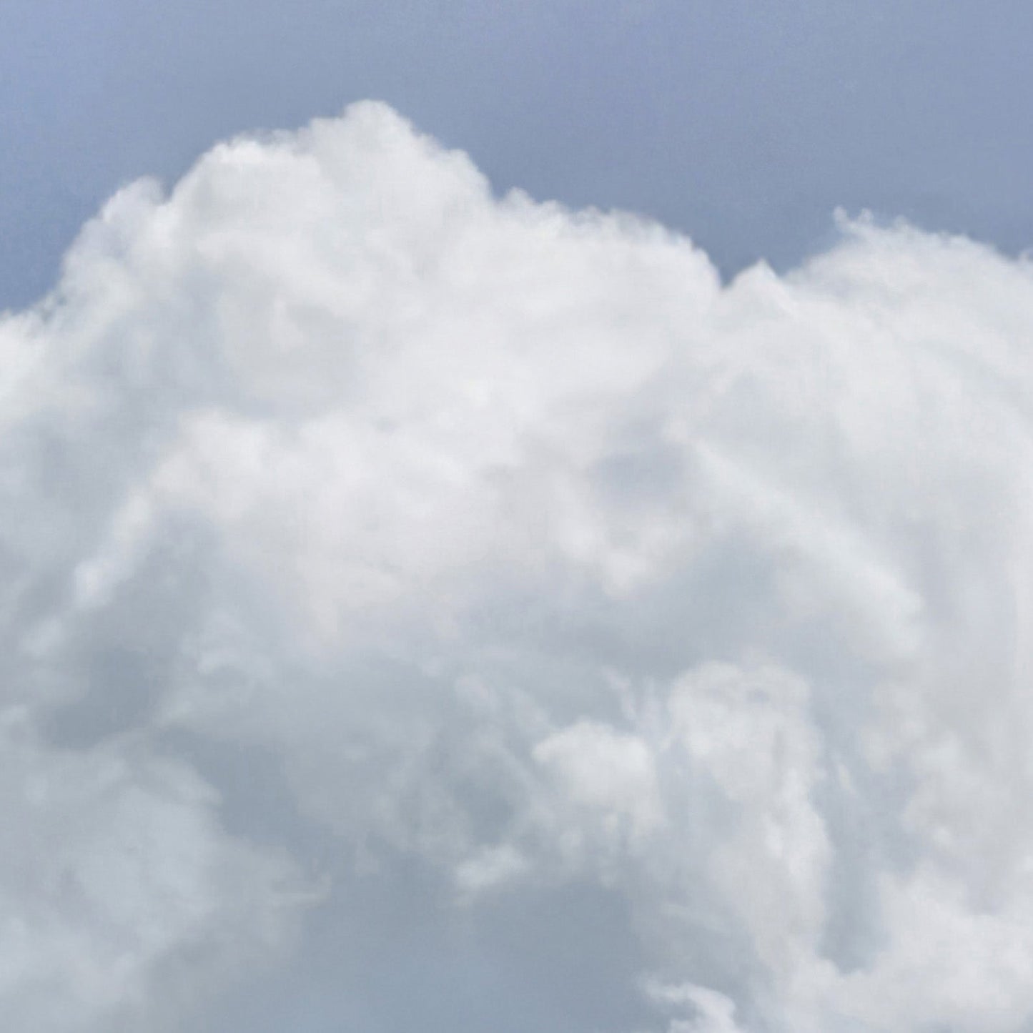 Extreme Close Up Detail Of Fluffy Cloud · Sky Blue